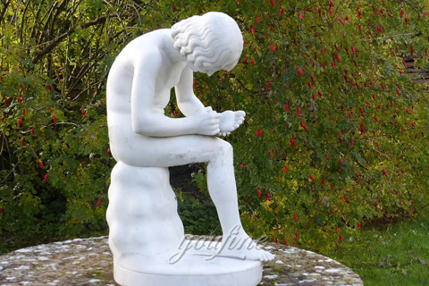 Boy with thorn statue